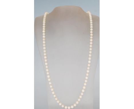 A vintage 20th Century cultured pearl necklace set on a stamped 835 silver clasp of round form set with blue stones. Measures