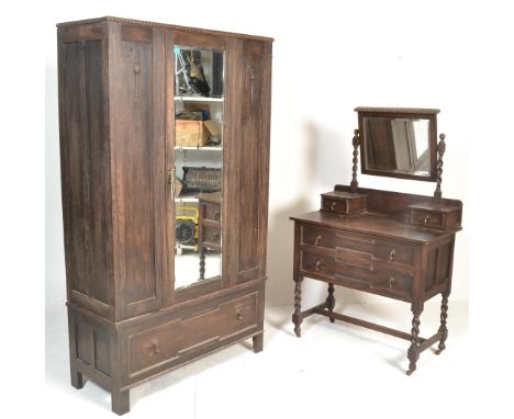 A 1920's Jacobean revival geometric moulded front single wardrobe and matching dressing table. Each with moulded drawers and 