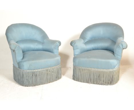 A pair of late 19th Century Victorian low nursing chairs / armchairs having lumbar support&nbsp; spoon back shaped backrests 