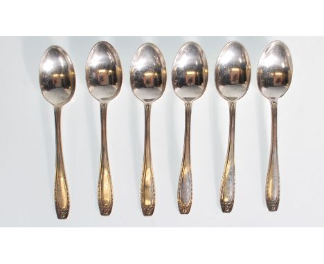 A set of six early 20th Century silver hallmarked tea spoons having decorative handles with swag like decoration. Hallmarked 