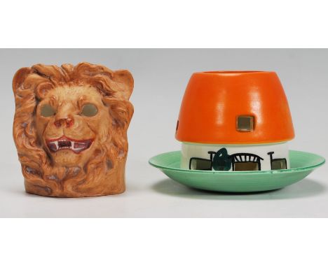A group of 2 early 20th Century Art Deco night lights to include a cover and saucer in the form of a cottage with an orange r