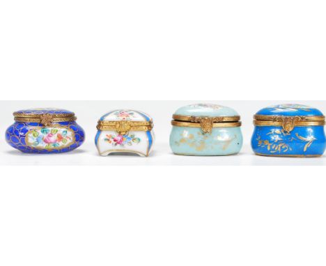 A group of ceramic Continental pill pots / boxes dating from the 19th Century to include three enamelled examples one light b