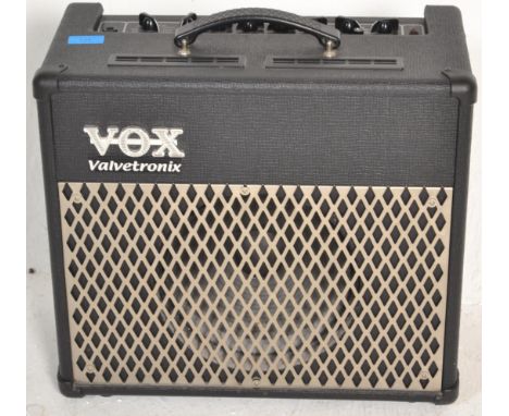 A Vox ' Valvetronix ' model AD30VT musical instrument or guitar amplifier / amp. Various knobs to top, with power lead presen