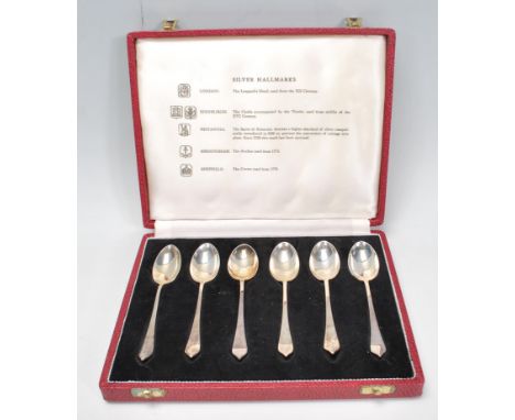 A 20th Century set of six Travis, Wilson &amp; Co Ltd tea spoons set within a red leatherette box. Hallmarked London 1971. We