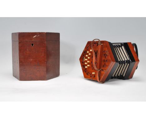 A 19th century Victorian Lacernal 21 button squeeze box complete in the mahogany octagonal carry case. The bellows appearing 