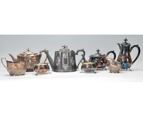 A collection of silver plated items to include a teapot, sugar bowl and creamer, pewter teapot, silver coffee pot and a pair 