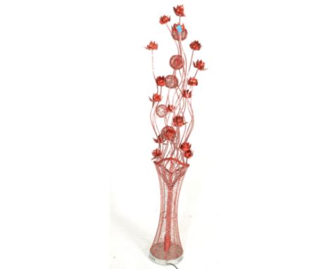 A 20th Century floor standing LCD lamp, constructed from wire and metal and modelled as a vase of poppies.&nbsp; Measures 155