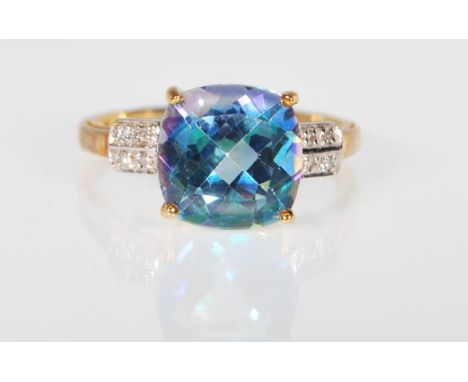 A 9ct gold hallmarked Neptune topaz and diamond dress ring, diamond chips to the shoulder flanking a large square cut Neptune