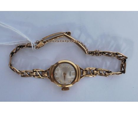 A vintage 20th Century ladies Medana Lever 17 jewels 9ct gold cocktail watch having a silvered dial with gilt arabic numerals