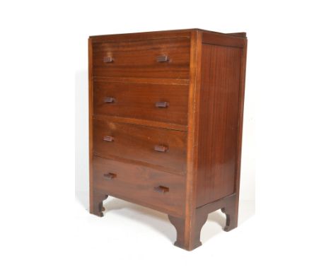A 1930's Art Deco Air Ministry type mahogany chest of drawers. Raised on bracket feet having an upright body with bank of 4 d