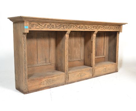 An early 20th Century oak top shelf unit / open window bookcase cabinet having&nbsp; three sections with carved floral work t