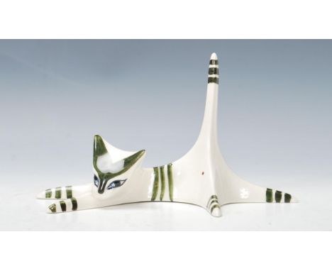 A vintage 20th Century white and green Jersey Pottery cat. The cat being signed to base with C.I and J. Measures 10cm tall by
