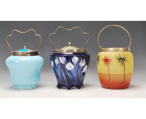 A collection of three late 19th / early 20th Century biscuit barrels to include an Art Nouveau blue and white example, a glas