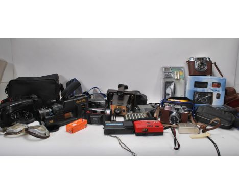 A collection of vintage cameras and accessories, various makes of cameras to include 35mm, lenses, cases etc.