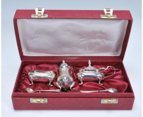 A 20th Century&nbsp;Barker Brothers silver cruet set consisting mustard pot, pepperette, and table sale complete with spoon i