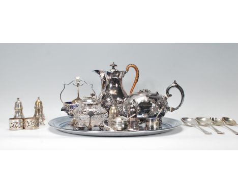 A collection of silver plated items to include coffee pot, salver tray, condiments, table salts with blue glass liner, bon bo