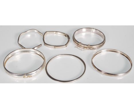 A group of six stamped 925 silver bangle bracelets to include a mother of pearl inlaid spacer bracelet, an engraved foliate d