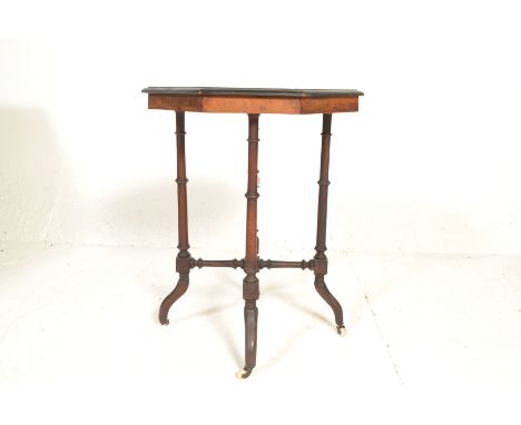 A Victorian 19th century Aesthetic movement amboyna wood ebonised marquetry inlaid occasional table. Raised on a french kick 