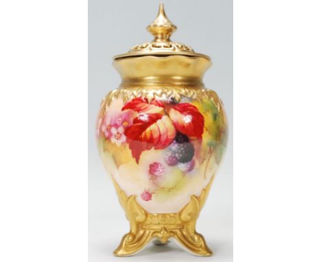 ROYAL WORCESTER LIDDED POT. A large hand decorated with fruit and floral detailing Royal Worcester gilt lidded baluster pot p