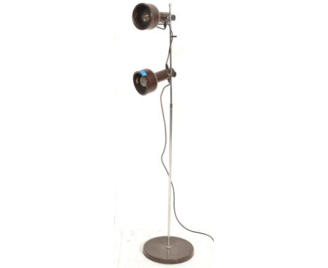 A retro 20th Century twin adjustable spot floor standing lamp raised on a circular base in original colourway.&nbsp; Measures