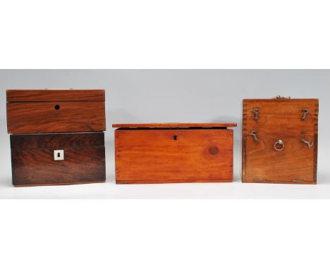 A collection of four boxes dating from the 19th Century to include a rosewood tea caddy, a rosewood question / ballot box wit