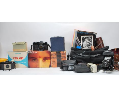 A collection of vintage 20th Century cameras and accessories to include 35mm cameras, boxed Ensign Camera No E29, boxed Polar