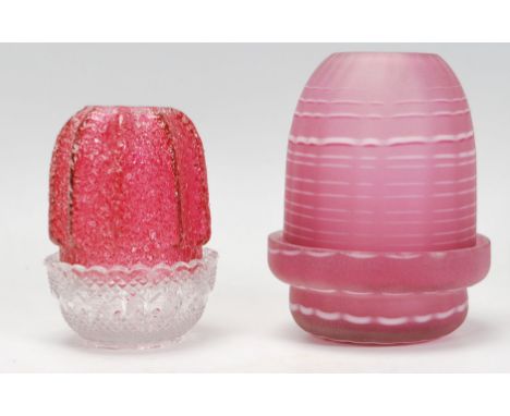 Two late 19th Century Victorian glass Fairy night lights to include a pink Nailsea glass night light having a pulled feathere