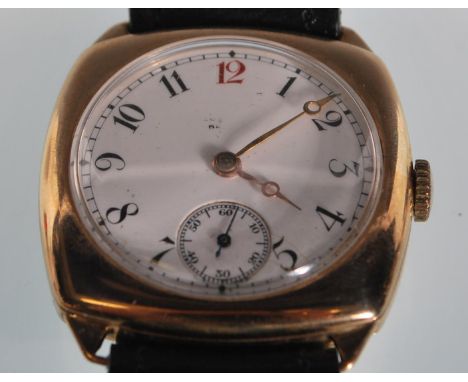 A 1930's Art Deco vintage gentleman's Longines 15 jewels wristwatch having a 9ct gold cushion shaped case with a round white 