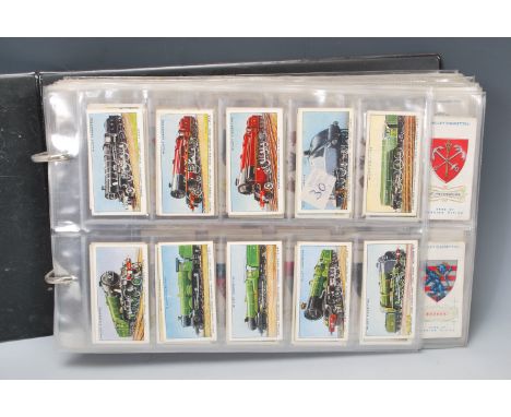A collection of vintage 20th Century Wills cigarette cards in full sets stored within plastic sleeves within an album. Sets t