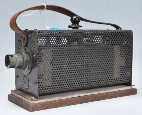 A vintage 20th Century theatre light having control switch atop via a sliding action, with lights to earthier end and carryin