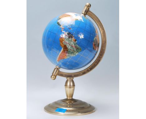 A vintage retro 20th century lapis lazuli type semi precious stone inlay desk top globe raised on stepped circular base with 