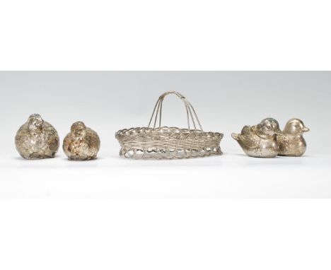 A group of four 20th Century silver plate salt and pepper condiments. Two in the form ducks and the others in the form of hen