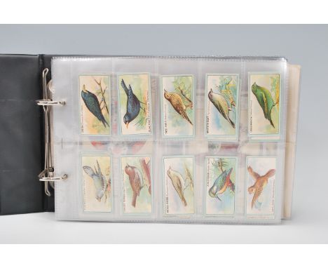 An album of vintage cigarette cards to include Chairman Juniors; Wonders of the World, Coronation Souvenir, English Birds. Ch