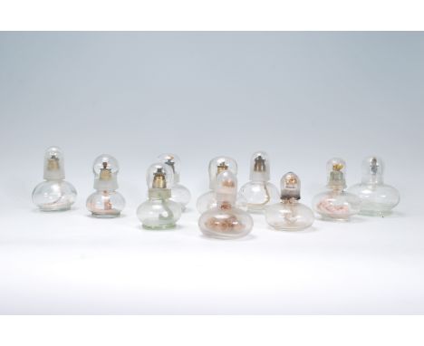 A group of ten presses glass oil lamp burners of small proportions dating from the 19th Century with each one having a glass 