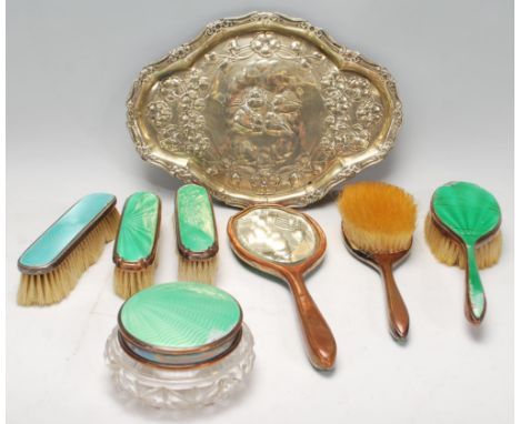 A silver hallmarked and engine turned enamel clothes brush being hallmarked for Birmingham 1925. Together with a silver plate