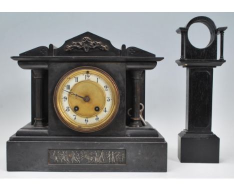 A late 19th / early 20th Century slate mantel clock having a pediment to top with columnal supports and classical frieze base