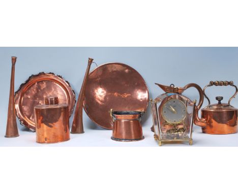 A collection of 19th and 20th century copper wares to include teapot, jug, hunting horn, bucket, 259 trays, pots etc along wi