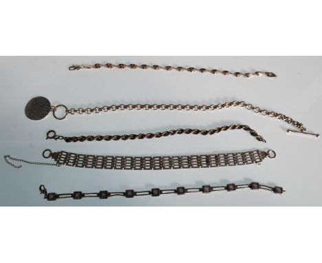 A selection of silver bracelets to include two twist chain bracelets, a silver gate link bracelet, a spacer bracelet set with