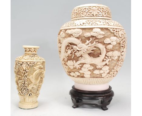 A 20th Century Chinese heavily carved ginger jar in the manor of cinnabar. Cover atop the bulbous tapering body. The body car