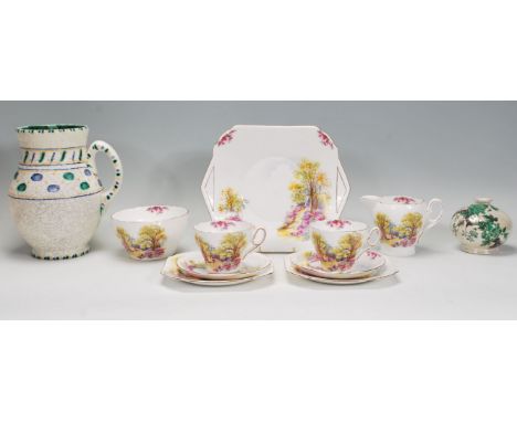 A vintage 20th Century Shelley&nbsp;"England's Charm" 0188 pattern part tea set comprising of two trios, sugar bowl, sandwich