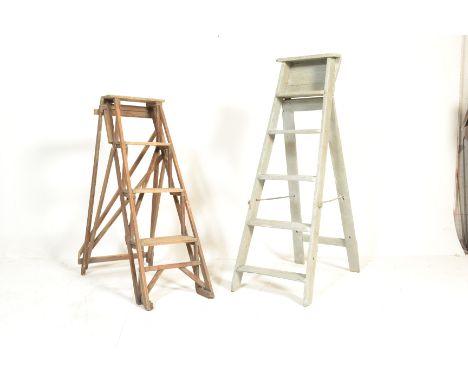 A good early 20th century a-frame trestle edges wooden ladder. Together with another painted Industrial wooden ladder. Each i