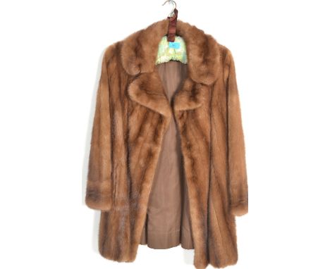 A 20th Century vintage ladies mink fur swing coat by the national fur company, hook and eye fastening. Size unmarked but appe
