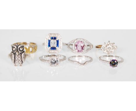 A selection of stamped 925 silver rings to include a cushion cut white stone ring with white accent stones, a mystic topaz ri