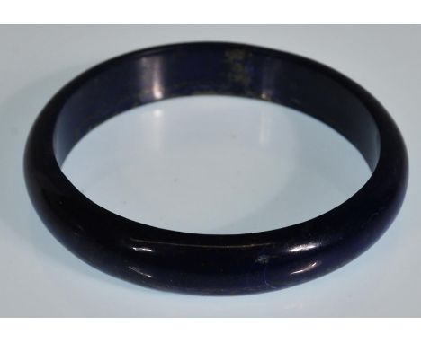 A Lapis Lazuli semi precious stone bangle. Inside measurement 7cm diameter.&nbsp;&nbsp;