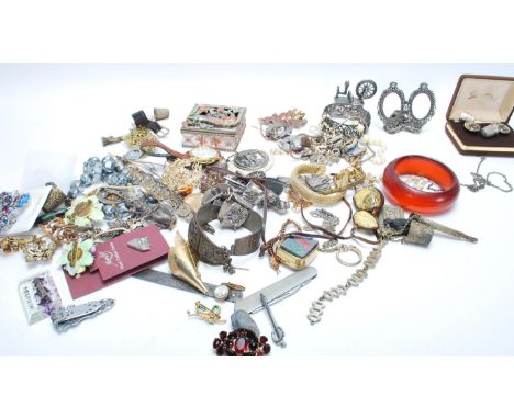 A collection of vintage and contemporary costume jewellery to include brooches, bangles, bracelets, necklaces etc.