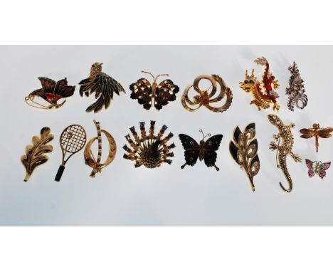 A selection of vintage 20th Century fashion jewellery brooches many being enamelled to include a Chinese dragon, a hummingbir