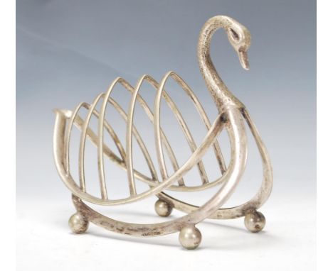 A vintage 20th Century silver plated four slice toast rack modelled as a Swan, marks to base raised on ball finial feet.