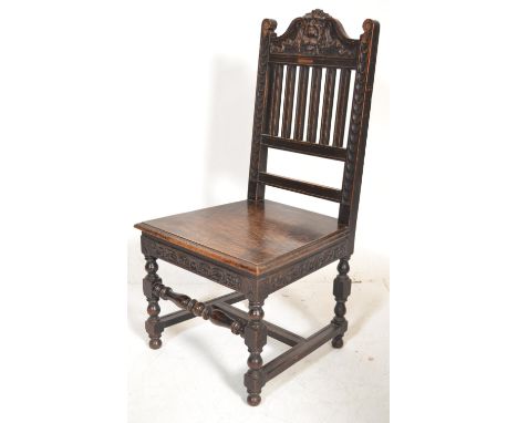 A Victorian 19th century carved solid oak hall chair having a green man carved mask top rail over panel seat and raised on bl