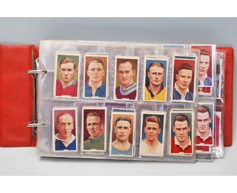 AN album of vintage cigarette cards to include, B Morris, Wax Art Series, Captain Blood, Measurement of Time, Animals at the 