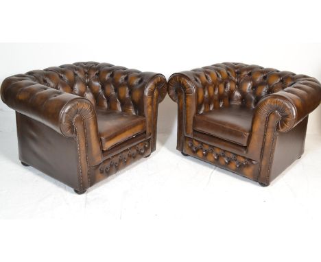 A good quality pair of Chesterfield leather&nbsp; armchairs by Thomas Lloyd. Button backed leather upholstered barrel arm cha